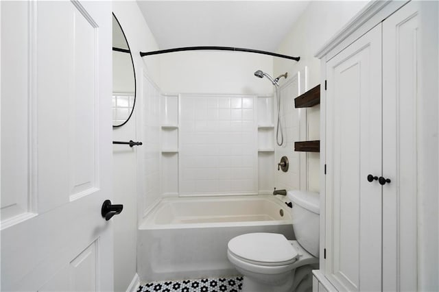 bathroom with tile patterned flooring, toilet, and shower / tub combination