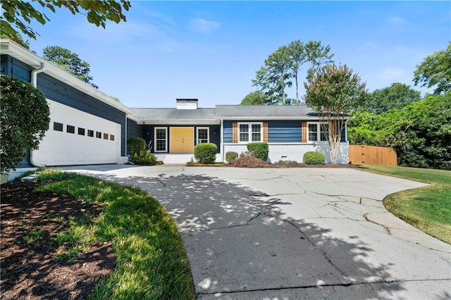 ranch-style home with concrete driveway, a garage, and fence