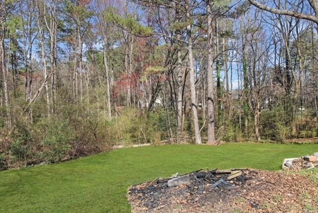 view of yard featuring a view of trees