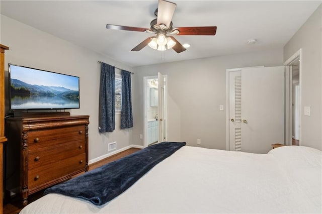 bedroom featuring visible vents, connected bathroom, a ceiling fan, and baseboards