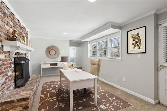 carpeted office with ornamental molding, a fireplace, and baseboards