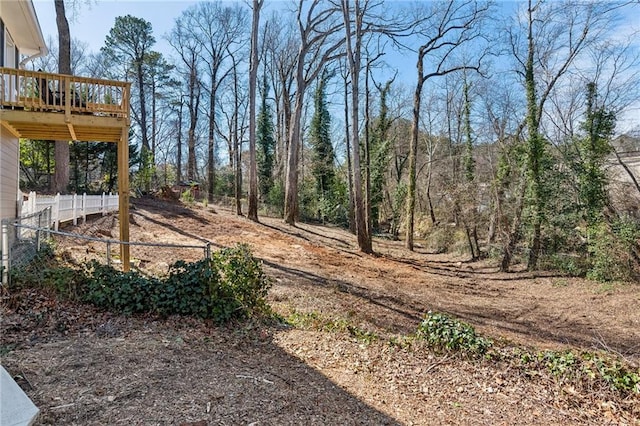 view of yard with fence and a deck