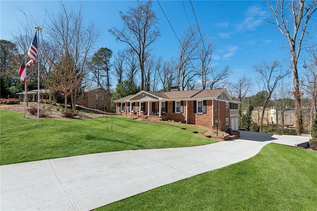 ranch-style house featuring brick siding, a chimney, a garage, driveway, and a front lawn