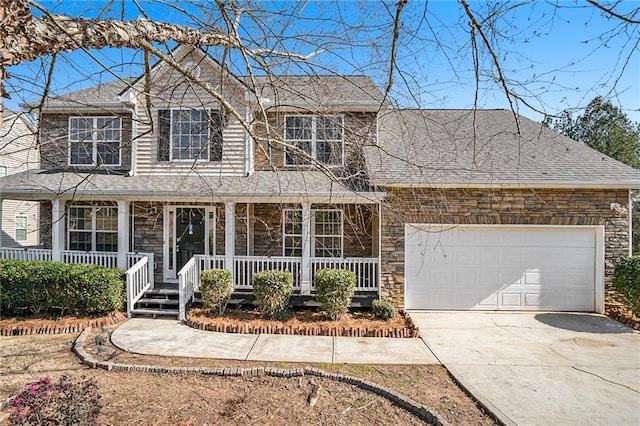 view of front facade featuring covered porch and a garage