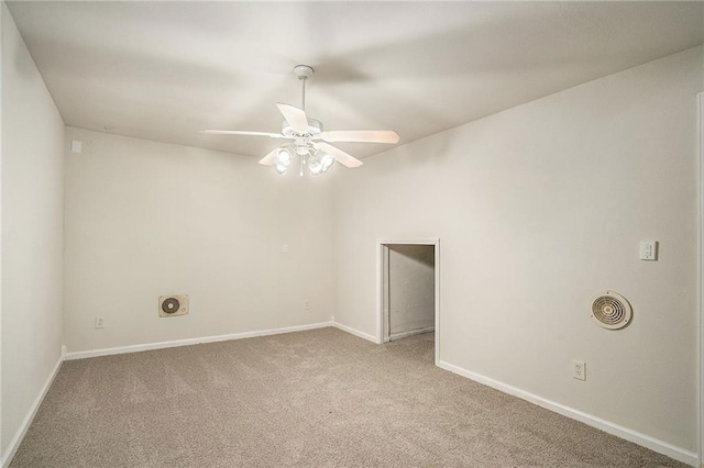 spare room with carpet flooring and ceiling fan