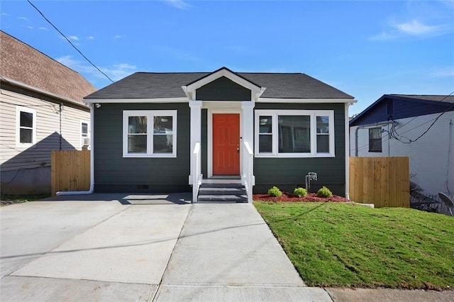 bungalow-style house with a front yard