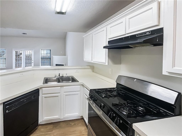 kitchen with light countertops, gas stove, white cabinetry, dishwasher, and under cabinet range hood