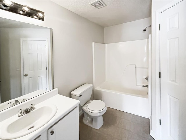 bathroom with visible vents, toilet, washtub / shower combination, a textured ceiling, and vanity