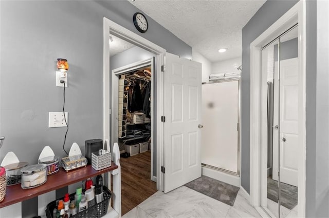 interior space featuring a textured ceiling