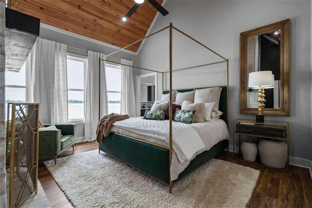 bedroom with high vaulted ceiling, wood-type flooring, wooden ceiling, and a water view