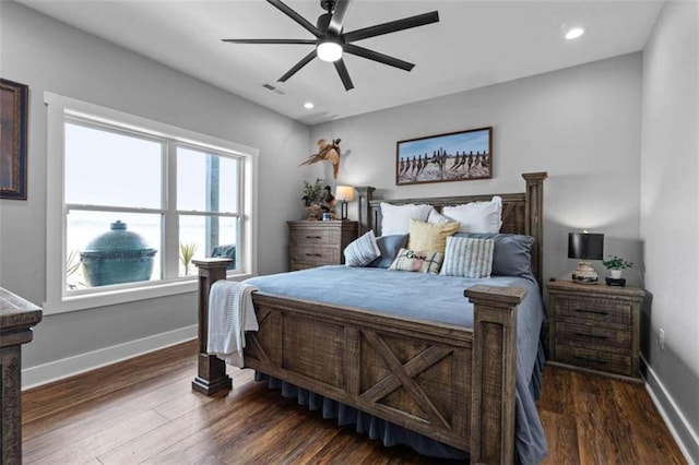 bedroom featuring ceiling fan and dark hardwood / wood-style flooring