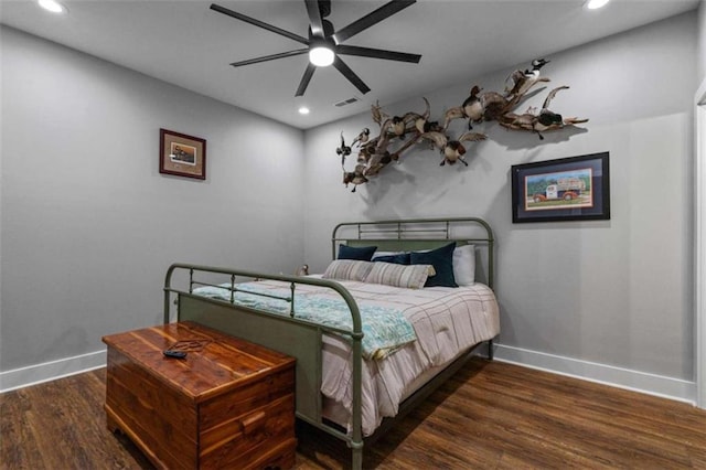 bedroom featuring dark hardwood / wood-style floors and ceiling fan