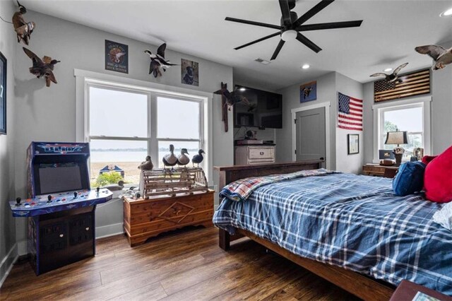 bedroom with hardwood / wood-style flooring and ceiling fan