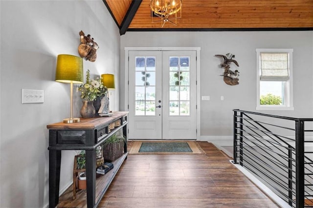 foyer featuring french doors, wood ceiling, an inviting chandelier, lofted ceiling with beams, and dark hardwood / wood-style floors