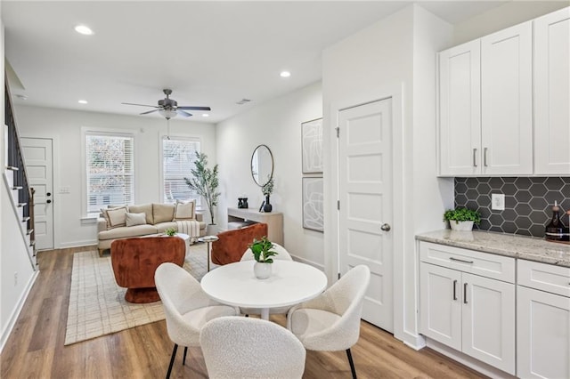 1095 Tucker Ave Unit 207, Atlanta, GA 30310 - dining space with stairway, a ceiling fan, light wood-style flooring, baseboards, and recessed lighting
