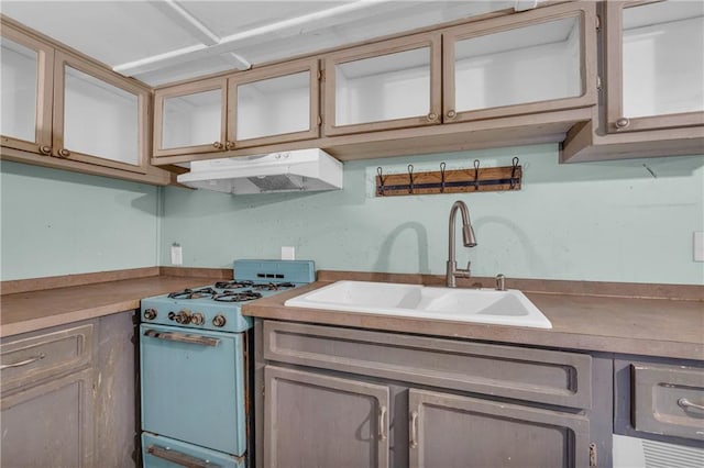 kitchen with white range oven and sink