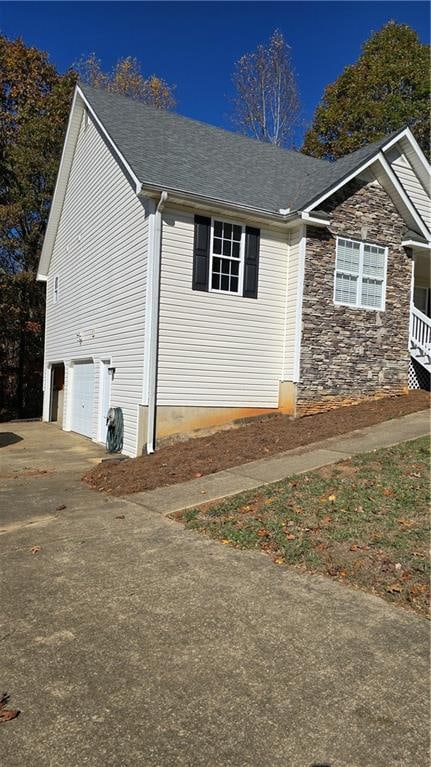 view of side of property with a garage