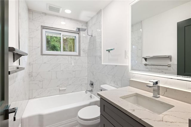 full bathroom with toilet, visible vents, vanity, and shower / bathing tub combination
