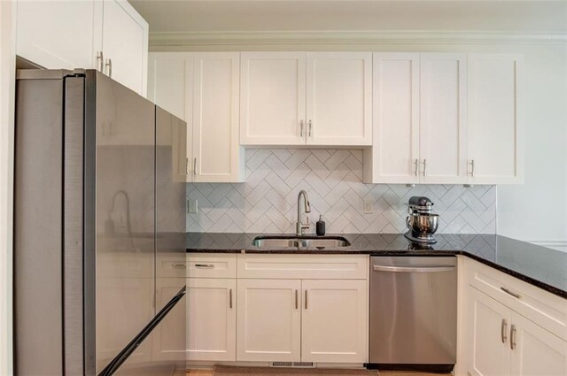 1038 Huntcliff, Atlanta, GA 30350 - kitchen with dark stone countertops, white cabinets, visible vents, stainless steel appliances, and a sink