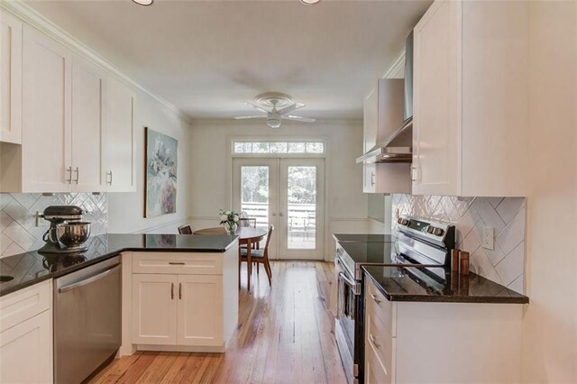 1038 Huntcliff, Atlanta, GA 30350 - kitchen featuring a peninsula, appliances with stainless steel finishes, and white cabinetry