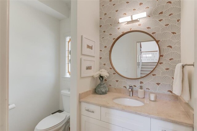 1038 Huntcliff, Atlanta, GA 30350 - bathroom with vanity, wallpapered walls, and toilet
