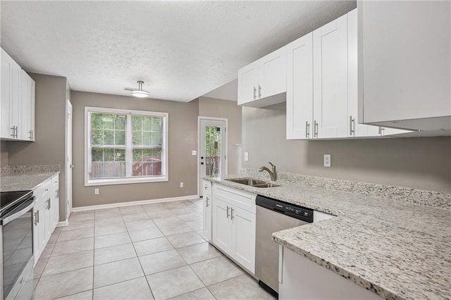 kitchen featuring a sink, light stone counters, white cabinetry, a textured ceiling, and appliances with stainless steel finishes