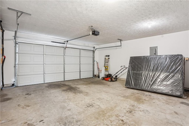 garage featuring a garage door opener and electric panel