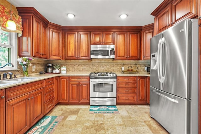 150 Victoria Sta, Woodstock, GA 30189 - kitchen with stainless steel appliances, a sink, tasteful backsplash, light stone finish floors, and light stone countertops