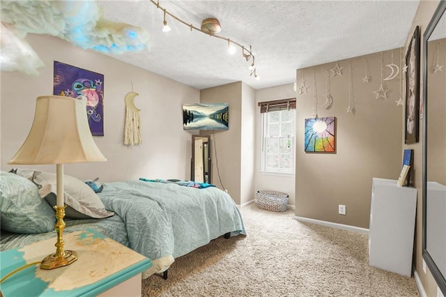 150 Victoria Sta, Woodstock, GA 30189 - bedroom with a textured ceiling, carpet floors, baseboards, and track lighting