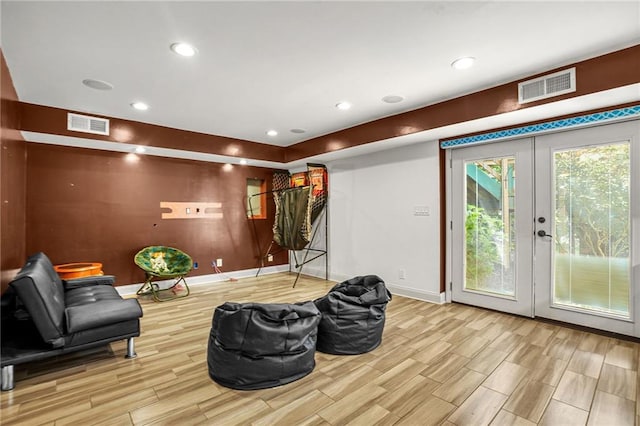 150 Victoria Sta, Woodstock, GA 30189 - sitting room with wood finished floors, baseboards, french doors, and recessed lighting