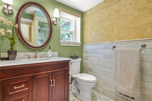 150 Victoria Sta, Woodstock, GA 30189 - bathroom with toilet, a wainscoted wall, vanity, and tile walls