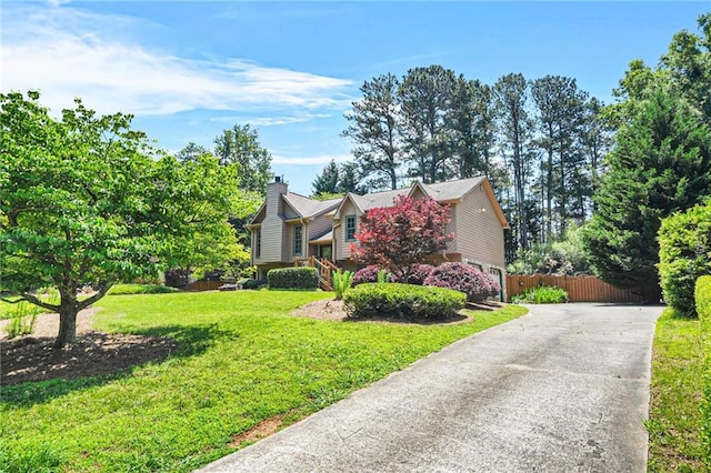 150 Victoria Sta, Woodstock, GA 30189 - view of front facade featuring a chimney, concrete driveway, and an attached garage