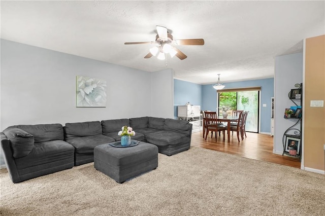 150 Victoria Sta, Woodstock, GA 30189 - carpeted living room with ceiling fan and baseboards