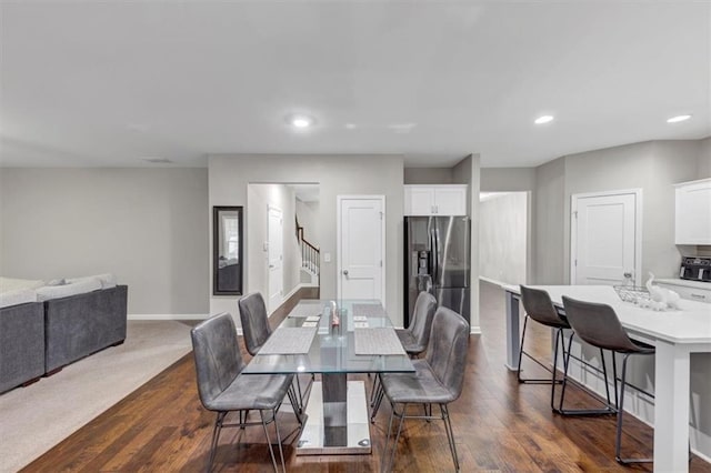 dining area with dark hardwood / wood-style flooring