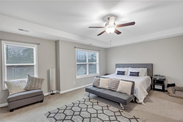 bedroom featuring ceiling fan and light carpet