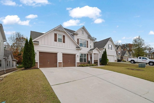 view of front of home with a garage and a front lawn