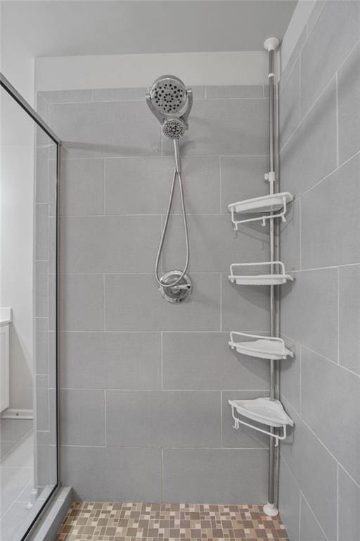 bathroom with a tile shower