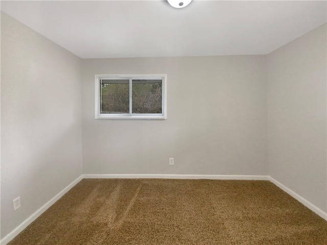 unfurnished room featuring carpet flooring