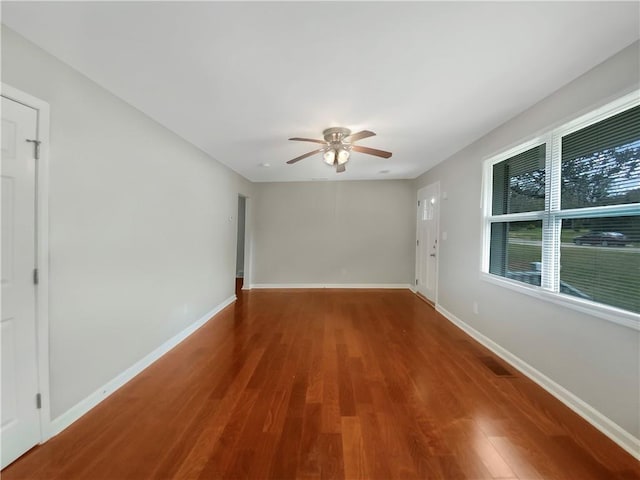 spare room with ceiling fan and wood-type flooring