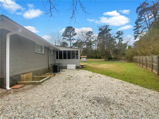 view of yard with central AC unit