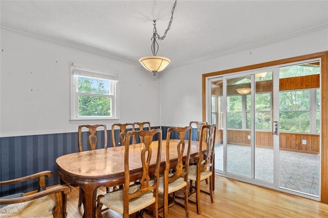 1690 Cedar Grove Dr, Marietta, GA 30066 - dining area featuring light wood-type flooring, ornamental molding, and wainscoting