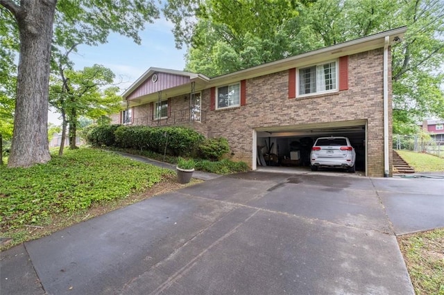 1690 Cedar Grove Dr, Marietta, GA 30066 - view of front of house with an attached garage, brick siding, and driveway