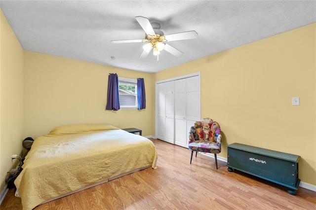 1690 Cedar Grove Dr, Marietta, GA 30066 - bedroom with wood finished floors, a closet, baseboards, ceiling fan, and a textured ceiling