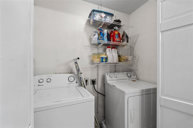 1690 Cedar Grove Dr, Marietta, GA 30066 - laundry room with washing machine and dryer and a textured ceiling