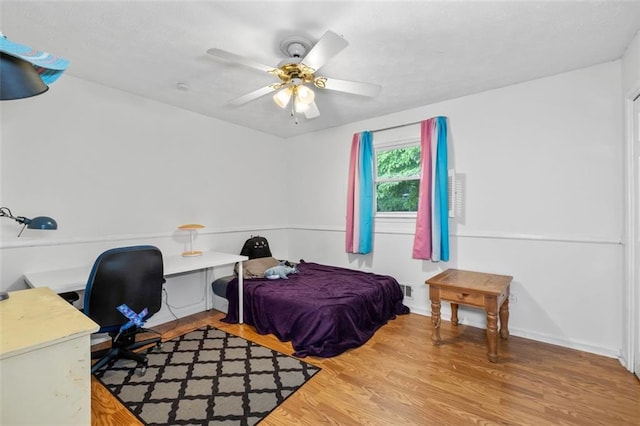1690 Cedar Grove Dr, Marietta, GA 30066 - bedroom featuring wood finished floors, a desk, and a ceiling fan