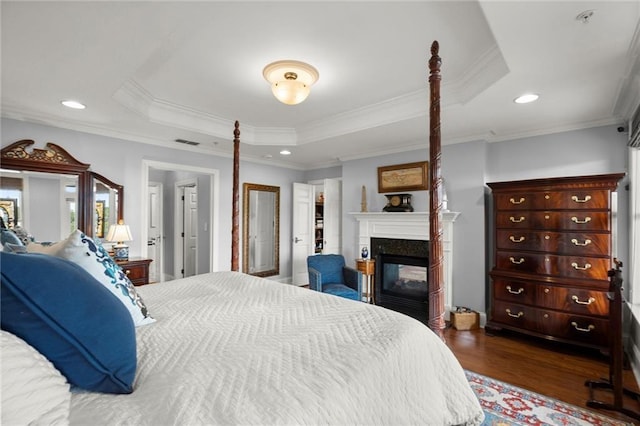 3330 Overland Dr, Roswell, GA 30075 - bedroom with a raised ceiling, dark wood-style floors, crown molding, a multi sided fireplace, and recessed lighting