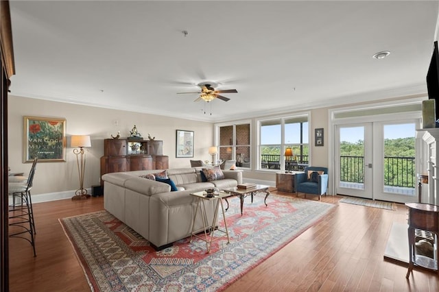 3330 Overland Dr, Roswell, GA 30075 - living room with crown molding, a ceiling fan, wood finished floors, and baseboards