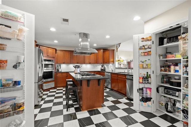 3330 Overland Dr, Roswell, GA 30075 - kitchen featuring island exhaust hood, appliances with stainless steel finishes, a sink, a breakfast bar, and a kitchen island