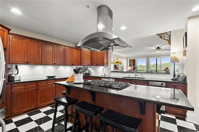3330 Overland Dr, Roswell, GA 30075 - kitchen featuring light flooring, a sink, island exhaust hood, a kitchen bar, and gas cooktop