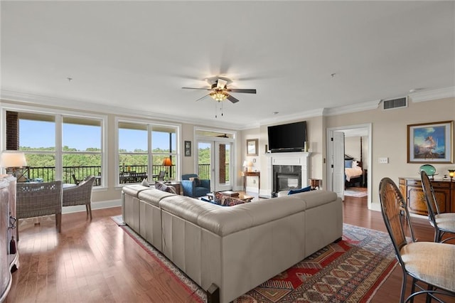 3330 Overland Dr, Roswell, GA 30075 - living room with ornamental molding, baseboards, a ceiling fan, a high end fireplace, and wood finished floors